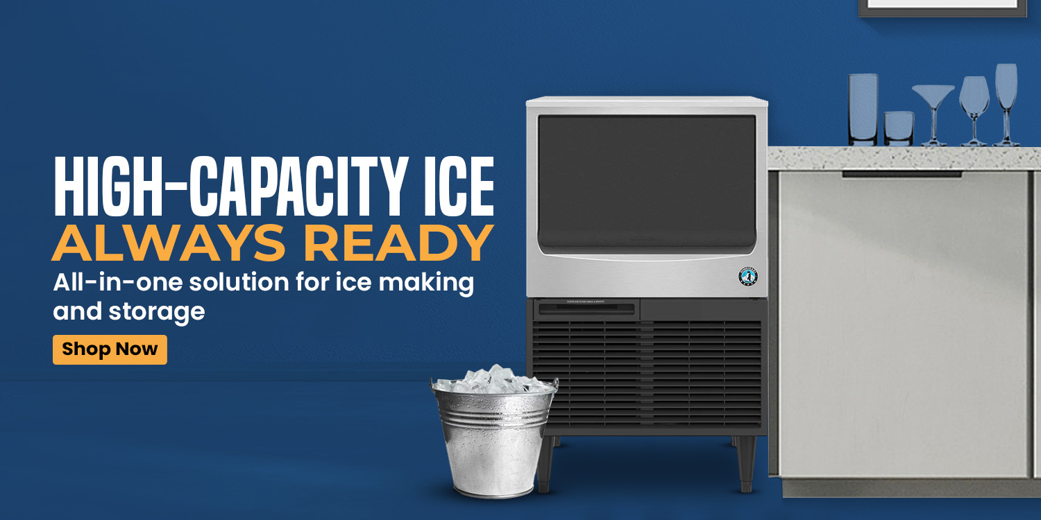 Commercial ice maker unit with built-in bin, placed beside a counter and glassware — perfect for bars, cafés, and restaurants.